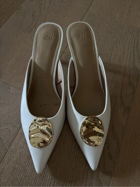 H&M White Pointed Slip-On Mules with Gold Medallion